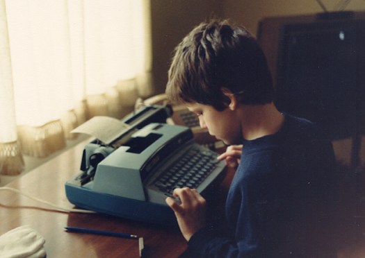 The young me and the noisiest typewriter on earth. Lordy, did I love it. 